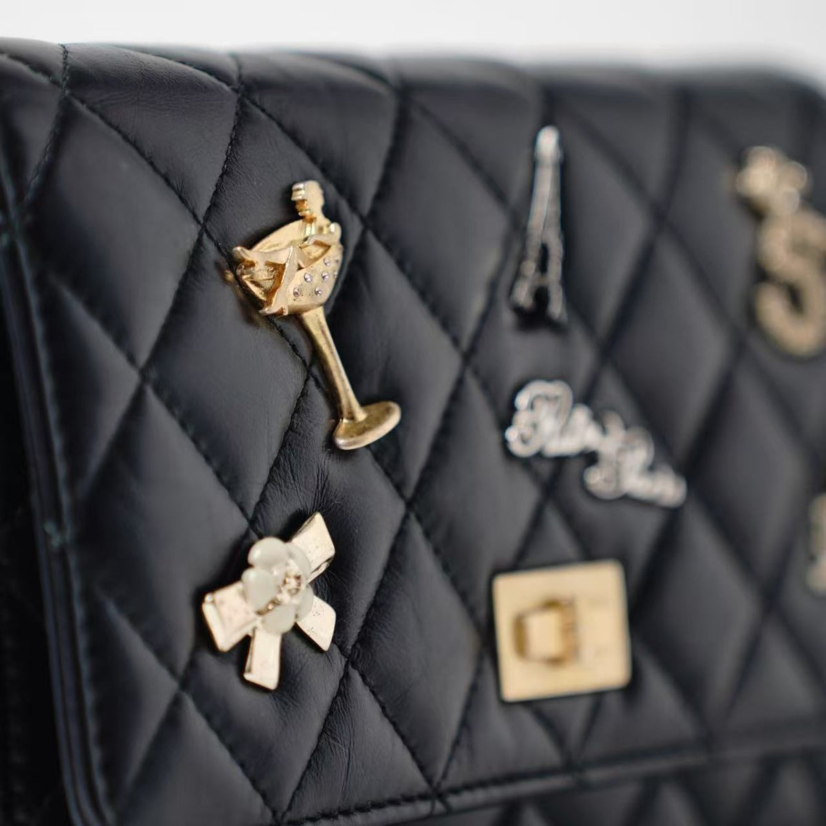 Chanel Reissue WOC Paris‑Themed Charms Wallet On Chain